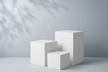 Three white cubes against a gray background
