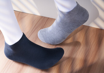 Cotton socks are worn on the model stand for display