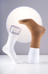 Cotton socks are worn on the model stand for display
