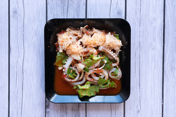 A spicy, sour, and salty meat salad.