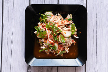 A spicy, sour, and salty meat salad.