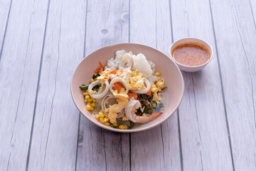 Suki is a Thai dish made from glass noodles, meat, eggs, vegetables and fermented bean curd sauce.