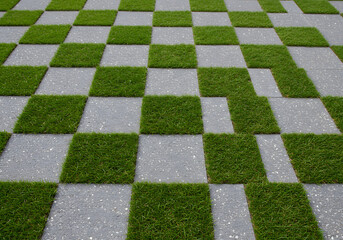 Modern Checkerboard Lawn Design Green Grass and Stone Pavers for Garden and Landscape.