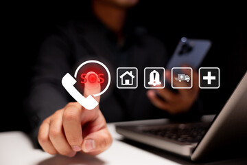 A person uses a smartphone and laptop, interacting with digital emergency icons including SOS,...