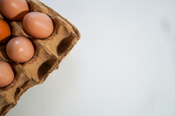 Several whole eggs on an egg carpet with negative space