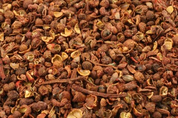Top view of bulk dried Sichuan pepper fruits