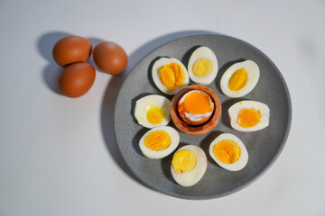 Various levels of doneness of boiled eggs with 3 whole eggs