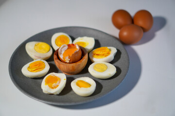 Various levels of doneness of boiled eggs with 3 whole eggs