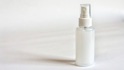 Studio shot of a blank white spray bottle, emphasizing its clean lines and customizable potential.