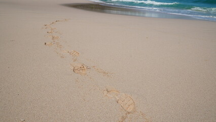 Shoeprints On The Beach