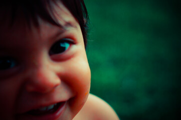 Close up of a Mexican baby, smiling