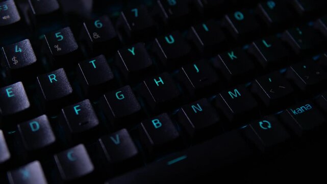 Macro shot of a hand installing a keycap onto a glowing yellow switch on a mechanical RGB keyboard. Dark tech vibe, ideal for keyboard modding, gaming setup, or tech tutorials.