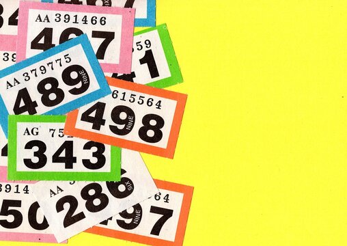 Vintage raffle tickets on a bright coloured background.