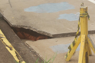 Rain-damaged asphalt collapsed