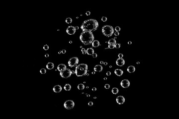 White bubbles, liquid, black background, abstract isolated, oxygen design concept, underwater,...
