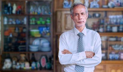 Senior Asian businessman wearing a white shirt and tie