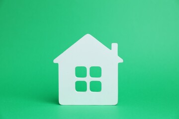 One white house model on green background