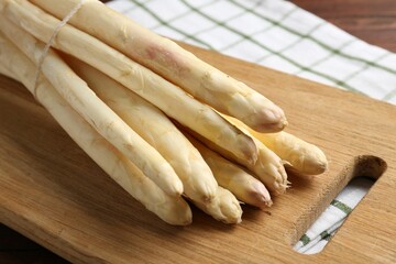 Bunch of asparagus spears on table, closeup