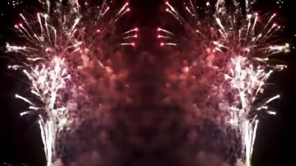 Symmetrical fireworks display in red and white colors for celebration against a black sky. - Powered by Adobe