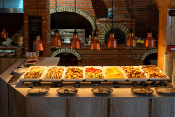 Romanian restaurant with cozy home atmosphere featuring traditional dishes served on the table for authentic dining experience
