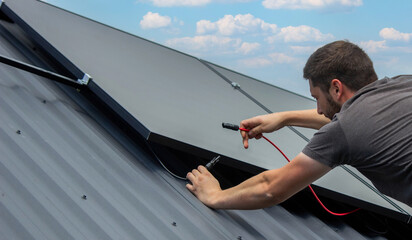 Technician Installing Solar Panels on Metal Roof