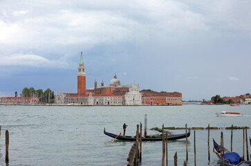 gondola the typical boat in venetian Lagoon in VENICE In Italy and Church of Saint George