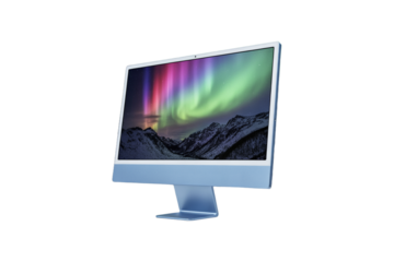 Modern computer monitor displaying a vibrant aurora borealis over snow capped mountains