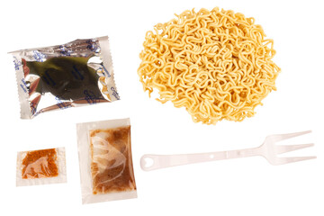 Cup of instant noodles, condiments, plastic forks on white background
