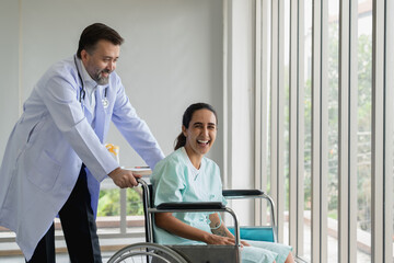 Fototapeta premium Specialist doctors providing medical treatment and discussing test results with patients in a hospital setting. Healthcare and wellness concept.