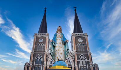 Roman Catholic church and Saint Mary statue at daytime in Chanthaburi, Thailand.