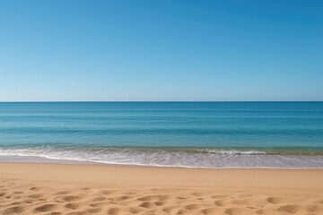 Obraz premium Sandy shore gentle waves clear blue sky beach ocean
