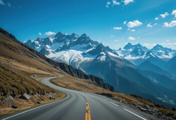Dramatic Snowy Peaks with Winding Mountain Pass Road