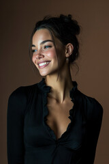 Beautiful model smiling and posing, showing white teeth and wearing elegant black dress