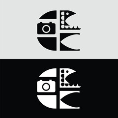 A striking black and white logo design features a camera and film reel arranged within a circular shape, creating a modern and artistic symbol