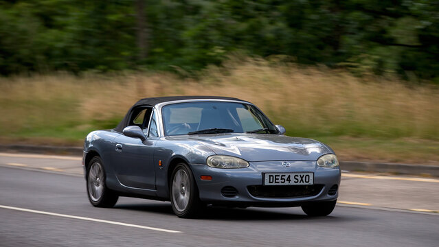 Milton Keynes,Bucks,UK - July 3rd 2025:  2004 Mazda mx5 car driving on a British road	