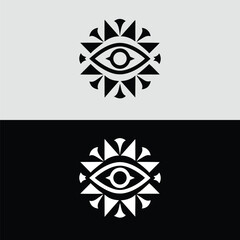 A striking black and white logo features an eye surrounded by triangular shapes, creating a modern and abstract symbol of vision and spirituality