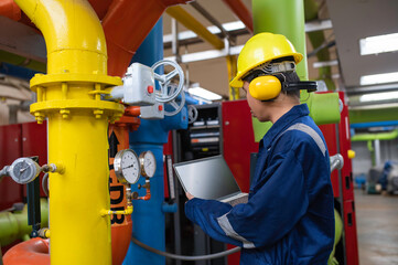 Maintenance technician at a heating plant,Petrochemical workers supervise the operation of gas and...