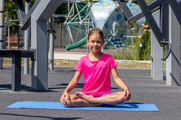Child sitting in lotus pose