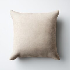 A beige pillow on a white wall