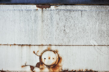 Rust and corrosion form texture on weathered metal surface