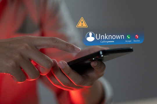 Phone call from unknown number late at night. Scam, fraud or phishing with smartphone concept. Prank caller, scammer or stranger. Man answering to incoming call. Hoax person with fake identity.