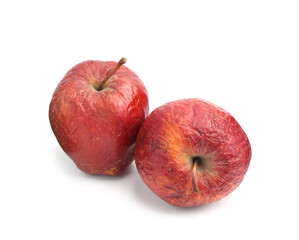 Two whole rotten apples isolated on white