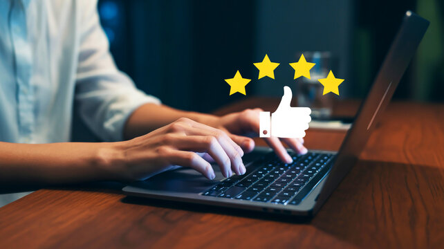 A close-up photograph of hands typing on a black laptop keyboard at ni - Powered by Adobe