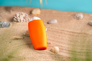 Sunblock or sunscreen in cosmetic tube on beach sand and beige background. Summer vacation and skin care concept with starfish and sea shells, spf uv-protect cosmetics. Skin health. High quality photo