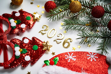 Abstract background of Christmas attributes with the year number 2026.