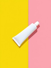 Simple White Cream Tube with White Cap Placed on Bright Yellow and Pink Background in Studio Lighting
