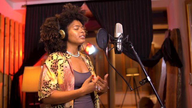Singer recording new song in professional studio