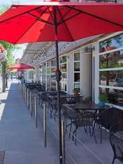  Tables and umbrellas outside a restaurant.