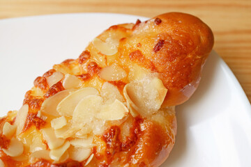 Delectable Homemade Almond Twist Bread on a White Plate