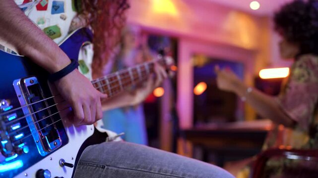 Energetic band rehearsal session with bass guitar and vocals